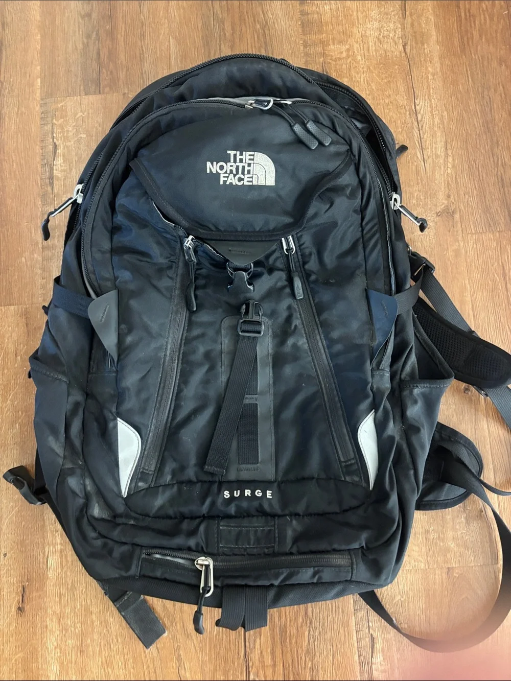 The North Face Surge Backpack in Black with Reflective Accents